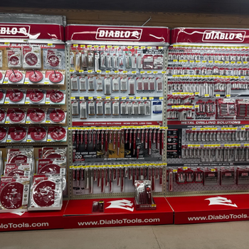 Store display of Diablo Tools, featuring various saw blades, drill bits, and cutting accessories organized neatly on shelves with red branding.